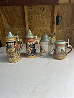 Four steins side by side showing size and variety