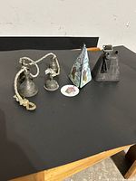 All three bell types displayed together on table