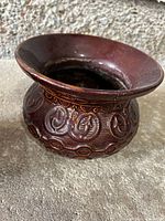 Brown glazed ceramic spittoon with embossed pattern