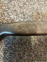 Close-up of Gromo maker’s stamp on handle