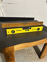 Mastercraft laser level and Hoppe wooden level displayed together