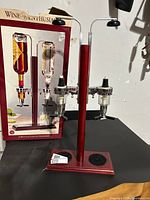 Liquor dispenser assembled in front of box