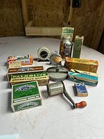 Overview of all boxed toiletries and kitchen tools on table