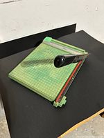 Top view of Premier paper cutter showing grid base and cutting arm