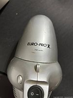 Top view of Euro-Pro 700W Shark handheld vacuum showing logo and wattage rating