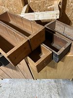Stacked wooden boxes showing interiors and divider slots