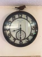 Sterling & Noble wall clock with bird finial and thermometer