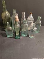 Group shot of all ten bottles standing upright