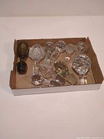 Ten assorted crystal and glass stoppers in box