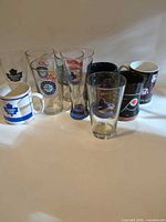 Group shot of assorted sports team glasses and mugs