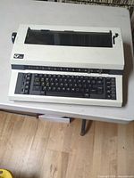 Full view of Nakajima ALL Call AE-355 electronic typewriter on table