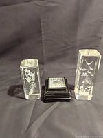 Two etched crystal blocks and lighted stand