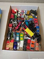 Top view of full box with mixed die-cast vehicles
