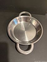 Top view of Calphalon stainless steel pan showing interior and handles