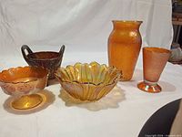 Five carnival glass items arranged together