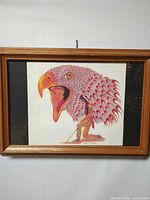 Full view of framed print showing artwork and wooden frame