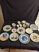 Group shot showing all commemorative plates and mugs
