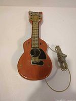 Front view showing guitar shape, cord, overall appearance