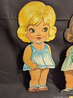 Blonde paper doll in blue slip