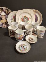 Group shot of all commemorative plates, mugs and dishes