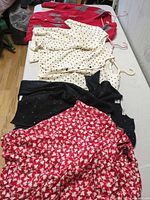 All six garments laid out on table