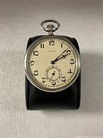 Front view showing dial, hands, crown and bow