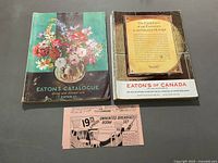 Front covers of both catalogues and loose advert page