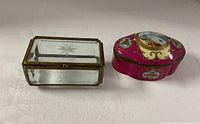 Rectangular glass casket and oval porcelain box closed