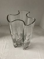 Top angled view showing wavy rim and thick glass walls