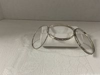 All three silver bangles standing on display rolls