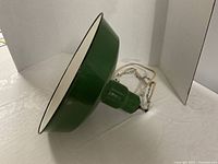 Side view showing green exterior and white interior enamel finish