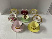 Group shot of eight tea cup and saucer sets