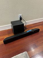 Soundbar and subwoofer front view on floor