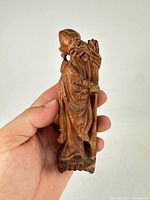 Front view of carved elder figure