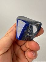 Front view of polished lapis lazuli showing blue color and pyrite flecks