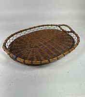 Top view of oval wicker tray with metal mesh rim