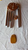 Chimes of Bali wind chime showing five silver tubes, wood components, full view