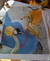 Entire print showing graphic design with crane and shoe