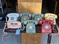 All seven telephones displayed on table