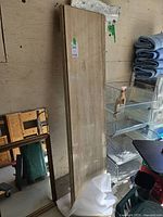 Full view of beige travertine marble tabletop leaning against wall