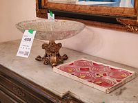 Candy dish and boxed coasters on marble surface