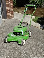 Full view of Lawn-Boy push mower showing deck, wheels, handle