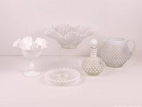 Group shot of six visible hobnail pieces