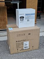Large sealed carton printed "Instant Pot Duo Crisp + Convection"
