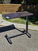 Full view of overbed table on casters