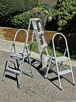 All three ladders standing outdoors