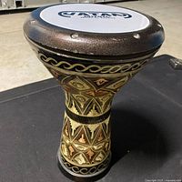 Angled view of top and body showing Vatan head and engraving