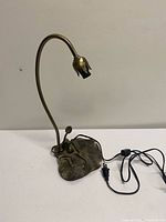 Full view of brass lily pad desk lamp with cord