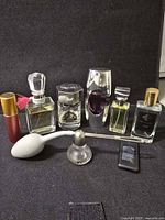 Group shot of all perfume bottles and accessories