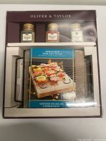 Front of sealed Oliver & Taylor Himalayan Pink Salt Plate gift set showing salt plate and three seasoning jars